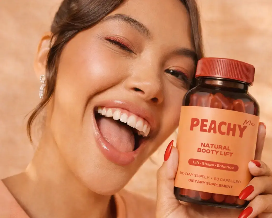 A happy woman holding a jar of Peachy product in her hands